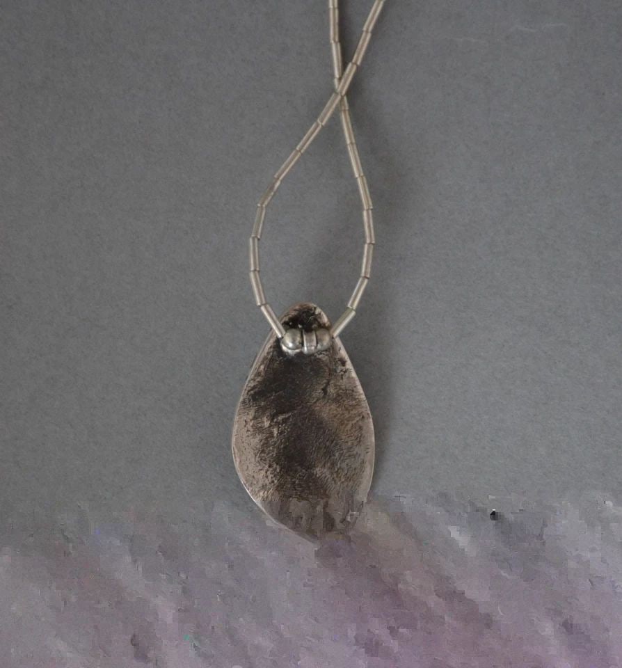HOPI STERLING SILVER PENDANT NECKLACE - BADGER PAW - TURQUOISE STONE - 16.5": HOPI STERLING SILVER PENDANT NECKLACE - BADGER PAW - TURQUOISE STONE - 16.5" This Hopi necklace has a badger paw pendant set with a turquoise stone. It is on a 16.5" long single strand liquid silver c