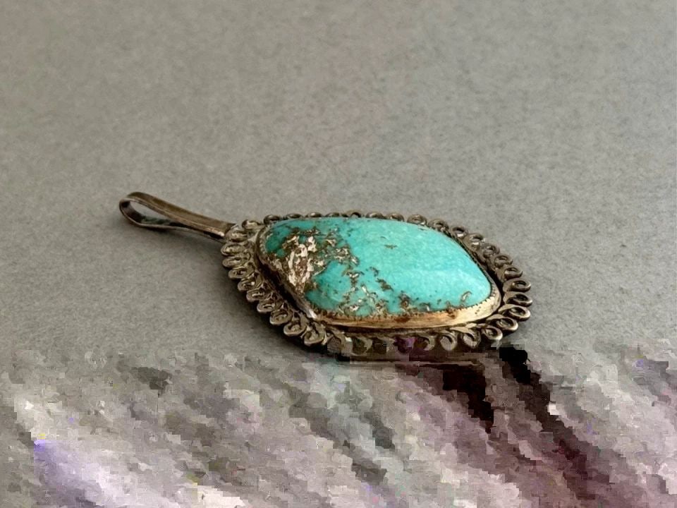 OLD PAWN NAVAJO STERLING SILVER AND TURQUOISE PENDANT: OLD PAWN NAVAJO STERLING SILVER AND TURQUOISE PENDANT Old Pawn Navajo Sterling Silver and Turquoise Pendant .. 1 7/8" Tall .. 1" Wide