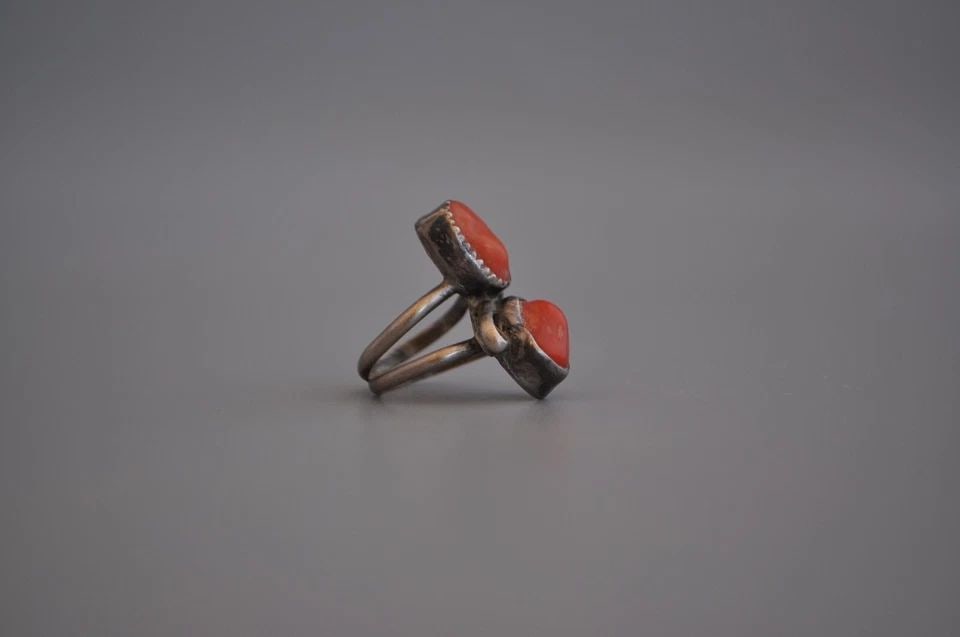 OLD PAWN NAVAJO STERLING SILVER RING CORAL SIZE 4: OLD PAWN NAVAJO STERLING SILVER RING CORAL SIZE 4 Weight 5.38 Grams 1" Tall Old Pawn Jewelry dates from the early 1900s to the 1970s. Most of it is not signed because it wasn't the Native American tra
