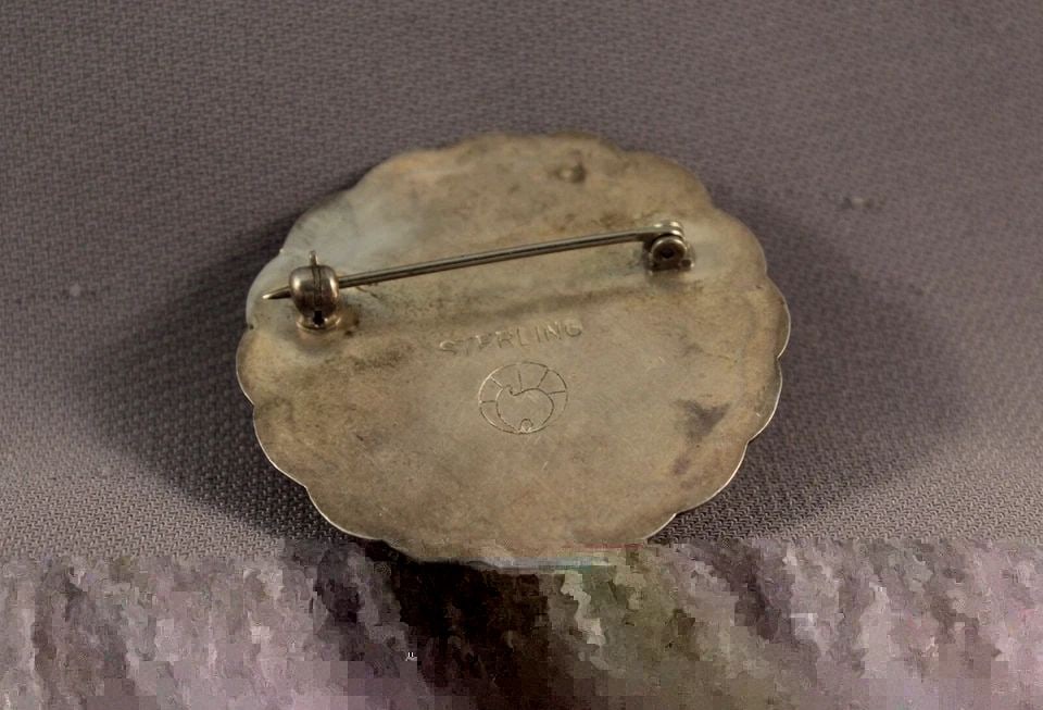 OLD PAWN STERLING SILVER AND STONE NAVAJO PIN - 1 5/8" ACROSS: OLD PAWN STERLING SILVER AND STONE NAVAJO PIN - 1 5/8" ACROSS Item Description: This pin measures 1 5/8" across and weighs 18 grams. It is marked sterling and is in great vintage condition.