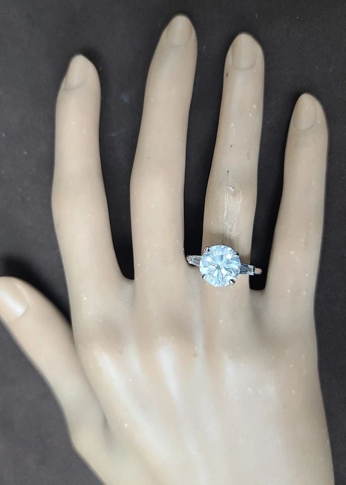 VINTAGE PLATINUM ENGAGEMENT RING 4.07CT.NATURAL ROUND CUT DIAMOND GIA CERT: VINTAGE PLATINUM ENGAGEMENT RING 4.07CT.NATURAL ROUND CUT DIAMOND GIA CERT This vintage platinum engagement ring boasts a stunning 4.07 carat natural round cut diamond in a solitaire with accents styl