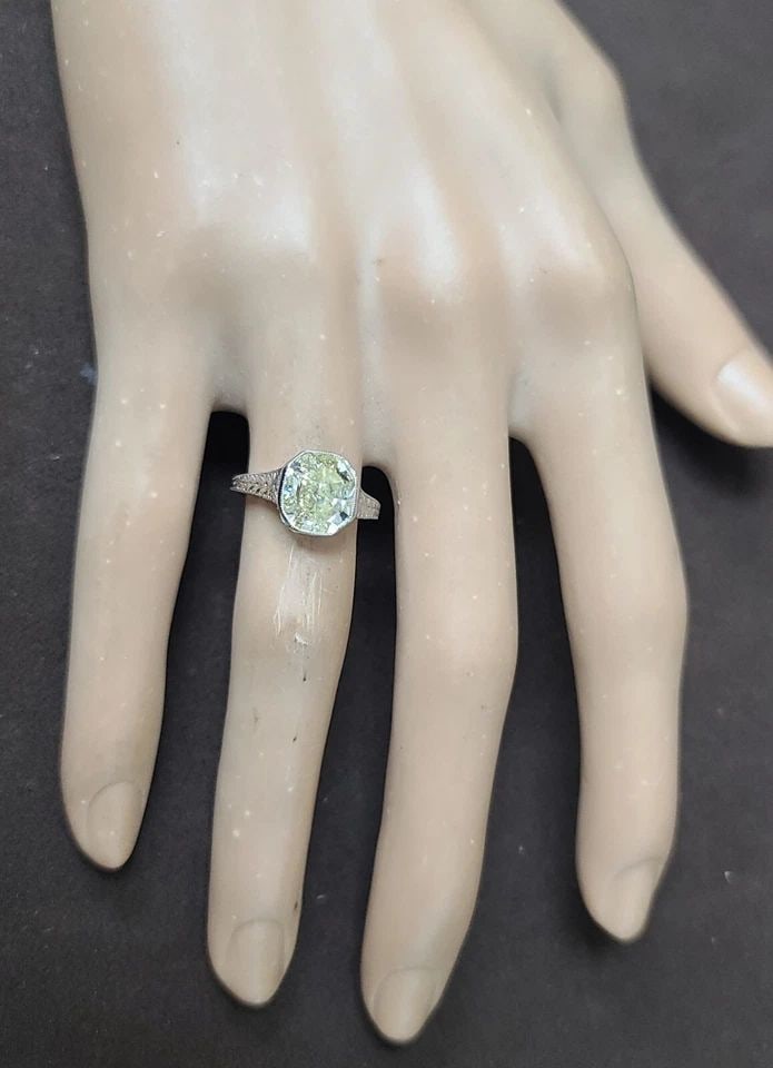 PLATINUM VINTAGE ENGAGEMENT RING 3.16CT.NATURAL YELLOW CUSHION DIAMOND GIA CERT: PLATINUM VINTAGE ENGAGEMENT RING 3.16CT.NATURAL YELLOW CUSHION DIAMOND GIA CERT The stunning 3.16ct yellow cushion yellow diamond ring is the epitome of vintage elegance. Crafted in platinum, this Art