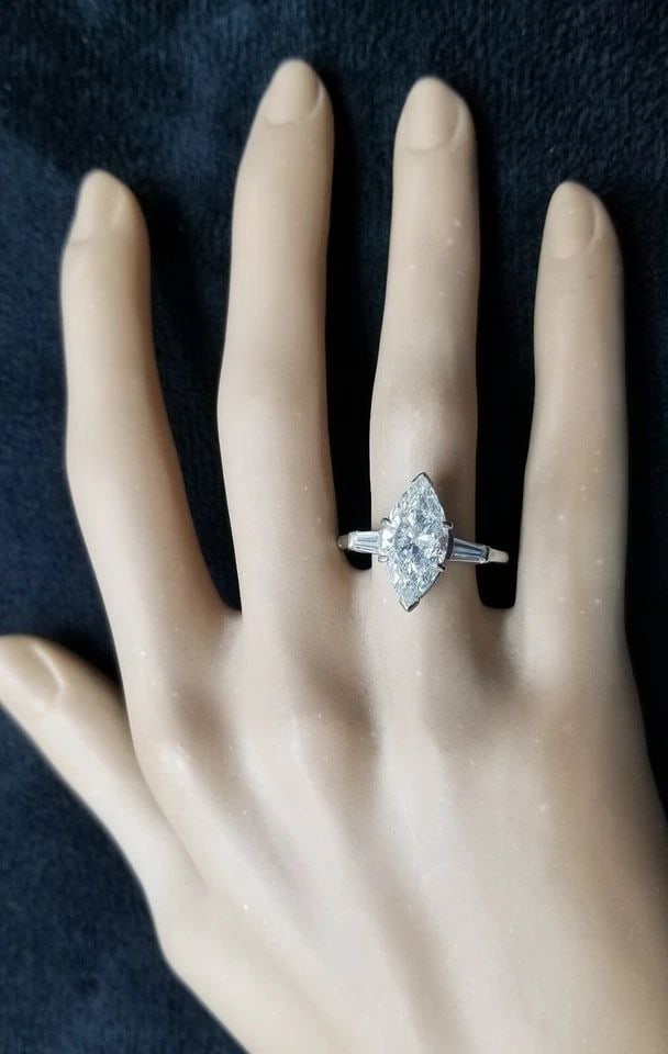 PLATINUM VINTAGE ENGAGEMENT RING 3.35CT. NATURAL MARQUISE DIAMOND SHAPE: 3.35CT PLATINUM VINTAGE ENGAGEMENT RING NATURAL MARQUISE DIAMOND I -SI2 Gorgeous Vintage marquise Diamond Platinum Engagement ring circ 1950's center marquise natural clarity enhanced diamond weight 3