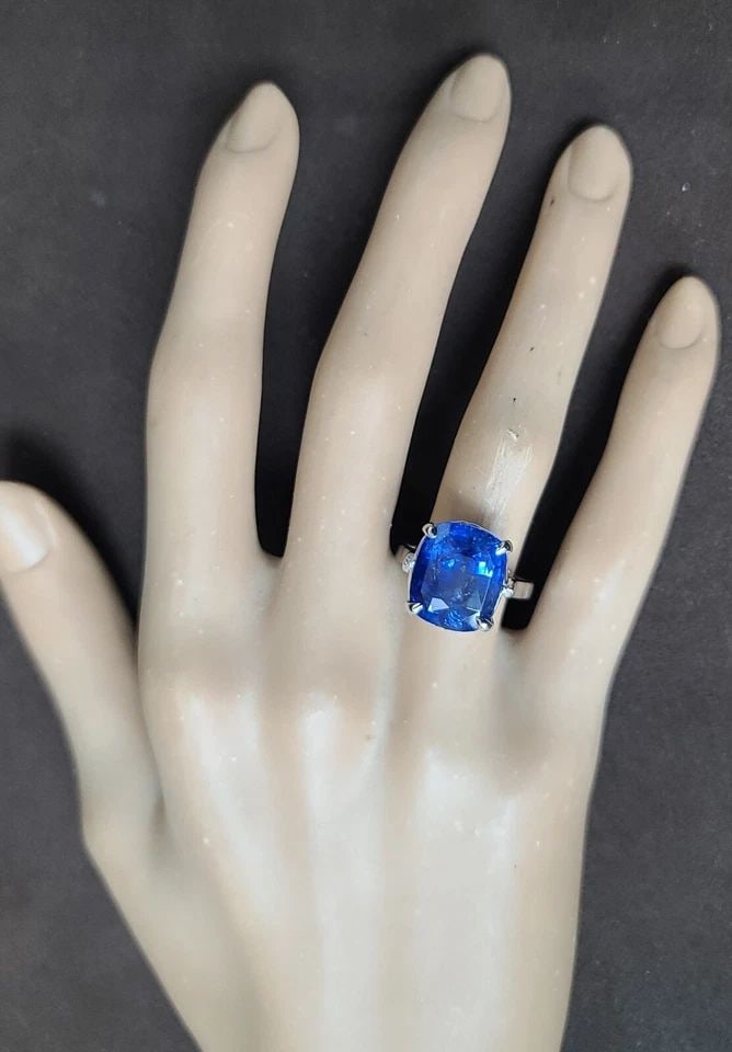 VINTAGE 14K WHITE GOLD ENGAGEMENT RING 10.41CT. NATURAL BLUE CUSHION SHAPE GIA: VINTAGE 14K WHITE GOLD ENGAGEMENT RING 10.41CT. NATURAL BLUE CUSHION SHAPE GIA This vintage engagement ring is a true beauty. Crafted from 14K white gold, it features a stunning natural blue cushion-s