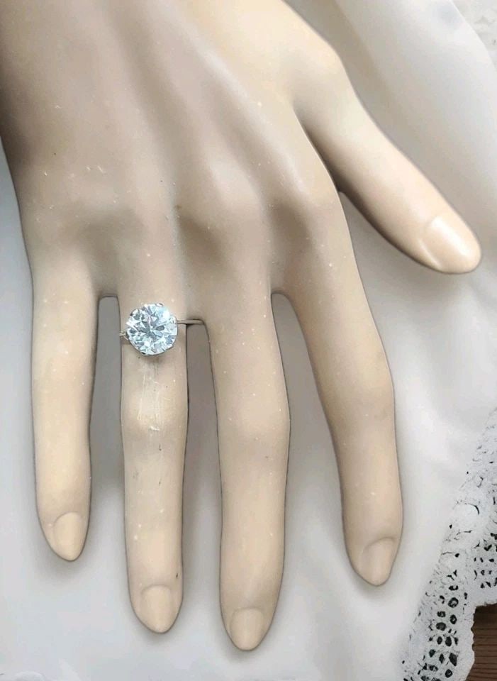 VINTAGE PLATINUM ENGAGEMENT RING 3.34CT. NATURAL OLD EURO CUT ROUND DIAMOND: VINTAGE PLATINUM ENGAGEMENT RING 3.34CT. NATURAL OLD EURO CUT ROUND DIAMOND A timeless expression of love, this exquisite vintage platinum engagement ring captures the romance of a bygone era. At its 
