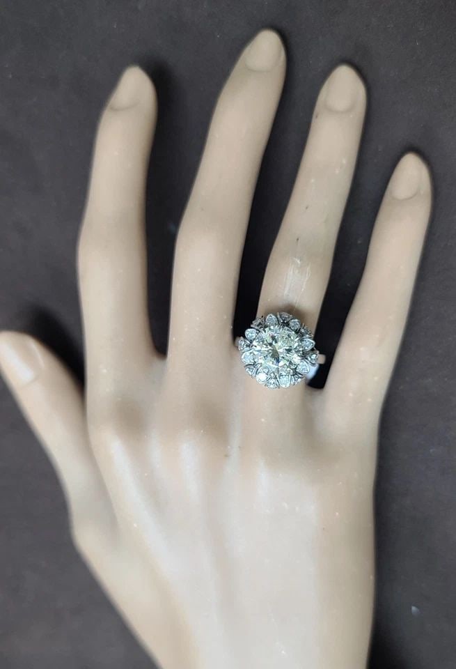 PLATINUM VINTAGE ART DECO FILIGREE ENGAGEMENT RING 3.59CT.NATURAL ROUND DIAMOND: PLATINUM VINTAGE ART DECO FILIGREE ENGAGEMENT RING 3.59CT.NATURAL ROUND DIAMOND This Platinum Vintage Art Deco Filigree Engagement Ring features a 3.59ct natural round diamond as the main stone, set i