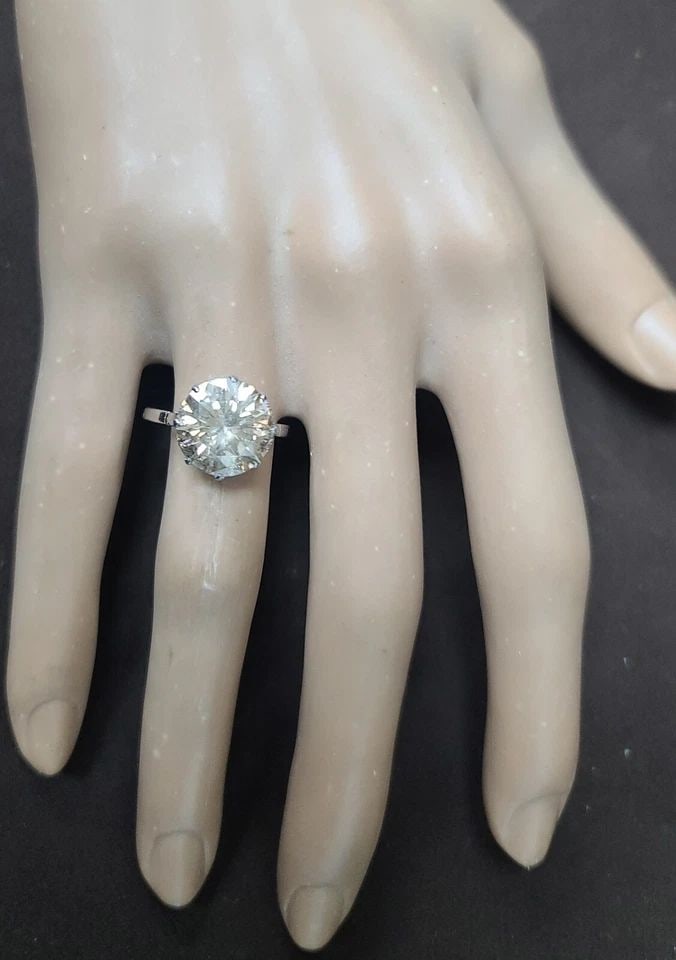 PLATINUM VINTAGE ENGAGEMENT RING 5.15CT. NATURAL ROUND CHAMPAGNE DIAMOND 1930'S: 5.15CT. PLATINUM VINTAGE ENGAGEMENT RING NATURAL ROUND CHAMPAGNE DIAMOND 1930'S This exquisite vintage platinum ring is a true beauty that will make any woman feel special. Featuring a stunning natura