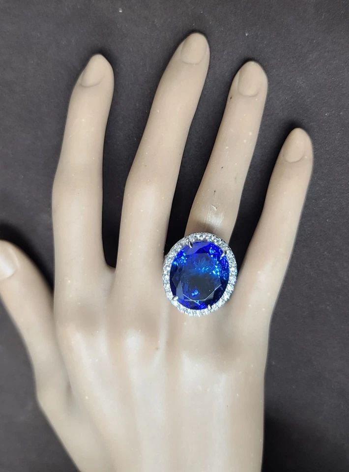 14K WHITE GOLD ENGAGEMENT RING – 23.11CT NATURAL TANZANITE & DIAMOND AGL CERT: 14K WHITE GOLD ENGAGEMENT RING 23.11CT.NATURAL TANZANITE OVAL SHAPE AGL CERT Gorgeous 14k white gold engagement tanzanite ring oval shape AGL CERT. Center natural tanzanite in oval shape weight 23.11c
