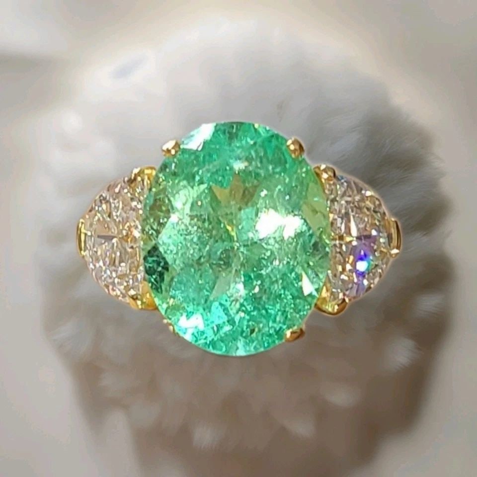 VINTAGE 18K YELLOW GOLD ENGAGEMENT RING 7.35CT.NATURAL COLOMBIA EMERALD GIA CERT: VINTAGE 18K YELLOW GOLD ENGAGEMENT RING 7.35CT.NATURAL COLOMBIA EMERALD GIA CERT This vintage 18k yellow gold engagement ring features a stunning 7.35CT natural Colombian emerald as the main stone, wi