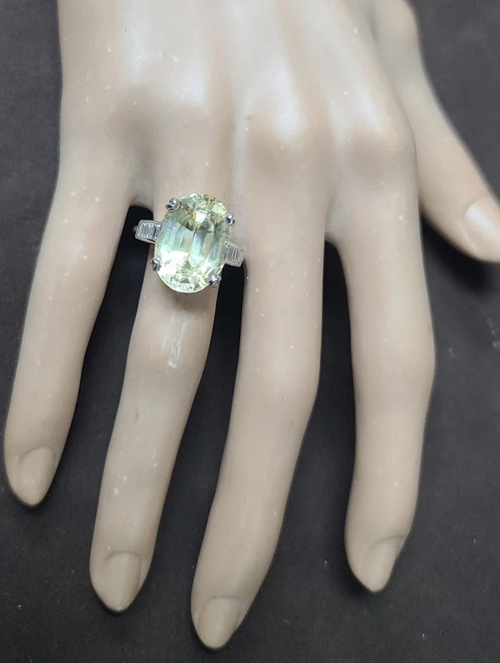 VINTAGE PLATINUM ENGAGEMENT RING 13.23CT. NATURAL YELLOW SAPPHIRE OVAL GIA CERT: VINTAGE PLATINUM ENGAGEMENT RING 13.23CT. NATURAL YELLOW SAPPHIRE OVAL GIA CERT Own a piece of history with this stunning vintage platinum engagement ring. The centerpiece is a breathtaking 13.23ct. n