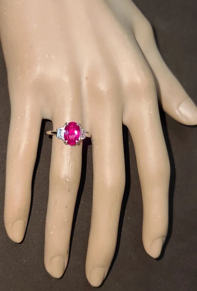 VINTAGE PLATINUM ENGAGEMENT RING 2.30CT. NATURAL BURMA OVAL RUBY AGL CERT: VINTAGE PLATINUM ENGAGEMENT RING 2.30CT. NATURAL BURMA OVAL RUBY AGL CERT This Vintage Platinum Engagement Ring features a stunning 2.30ct Natural Burma Oval Ruby accented with 2 Diamonds. The ring is
