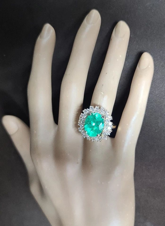 VINTAGE 14K YELLOW GOLD ENGAGEMENT RING 4.79CT.NATURAL COLOMBIA EMERALD GIA CERT: VINTAGE 14K YELLOW GOLD ENGAGEMENT RING 4.79CT.NATURAL COLOMBIA EMERALD GIA CERT This 14k Yellow Gold Engagement Ring features a stunning 4.79CT Natural Colombia Emerald in an Oval shape, with a GIA c
