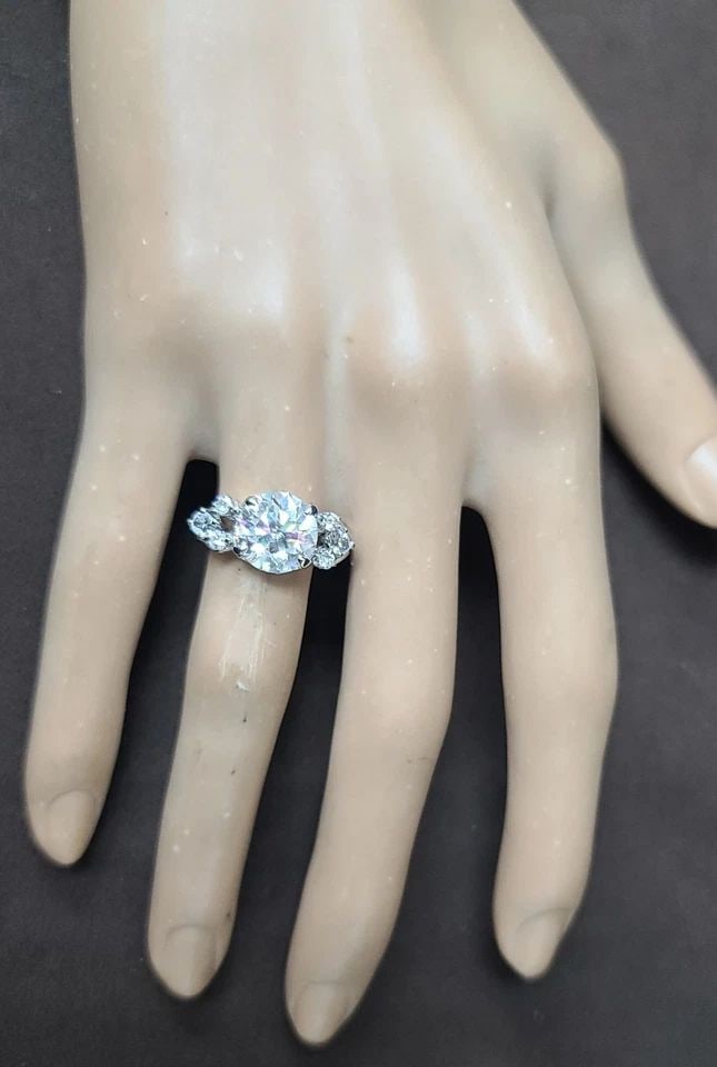 VINTAGE 14K WHITE GOLD ENGAGEMENT RING 2.82CT. NATURAL ROUND DIAMOND CIRCA 1950S: VINTAGE 14K WHITE GOLD ENGAGEMENT RING 3.35CT. NATURAL EURO CUT ROUND DIAMOND This vintage 14k white gold engagement ring features a 3.35CT natural Euro cut round clarity enhanced diamond as the main 