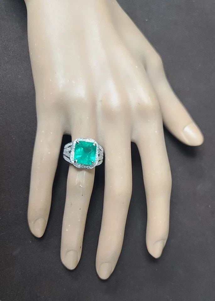 14K WHITE GOLD VINTAGE STATEMENT RING 5.29CT. NATURAL GREEN EMERALD GIA CERT: 14K WHITE GOLD VINTAGE STATEMENT RING 5.29CT. NATURAL GREEN EMERALD GIA CERT This vintage 14k white gold cocktail ring is a stunning statement piece that will add a pop of color to any outfit. The nat