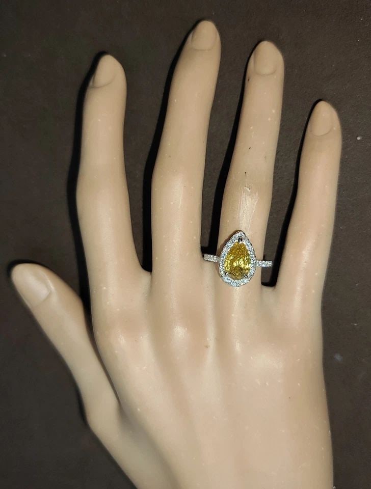 14K YELLOW GOLD ENGAGEMENT RING 1.91CT. NATURAL PEAR CUT YELLOW DIAMOND GIA CERT: 14K YELLOW GOLD ENGAGEMENT RING 1.91CT. NATURAL PEAR CUT YELLOW DIAMOND GIA CERT This 14k Yellow Gold Engagement Ring features a stunning 1.91CT natural yellow pear-cut diamond certified by GIA. The r