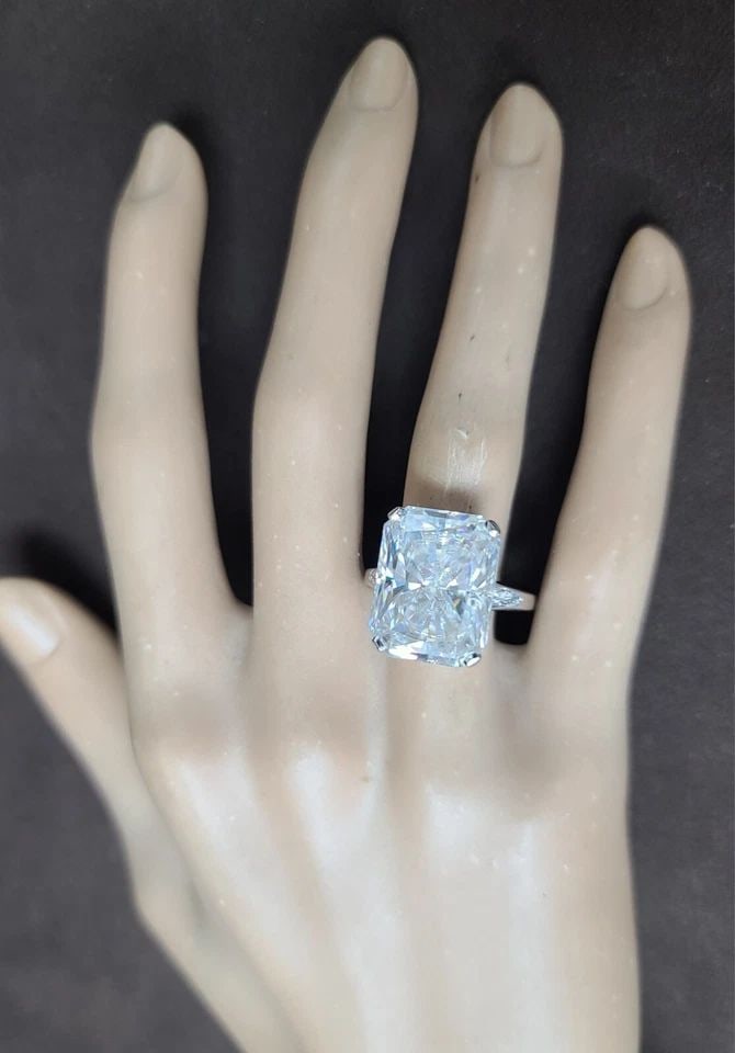 14K WHITE GOLD ENGAGEMENT RING 17.52CT LAB GROWN SIMULATE DIAMOND RADIANT SHAPE: 14K WHITE GOLD ENGAGEMENT RING 17.52CT LAB GROWN SIMULATE DIAMOND RADIANT SHAPE This vintage engagement ring is a stunning piece of fine jewelry that will make any occasion special. Crafted from 14k w