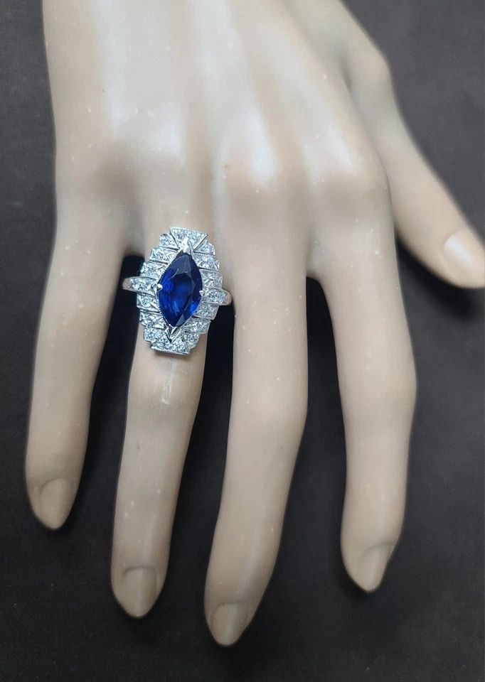 VINTAGE 14K WHITE GOLD RING 3.74CT. NATURAL BLUE SAPPHIRE MARQUISE CUT GIA CERT: VINTAGE ART DECO 14K WHITE GOLD RING 3.74CT. NATURAL BLUE SAPPHIRE MARQUISE CUT This stunning vintage Art Deco ring is crafted from 14k white gold and features a magnificent 3.74ct natural blue sapphi