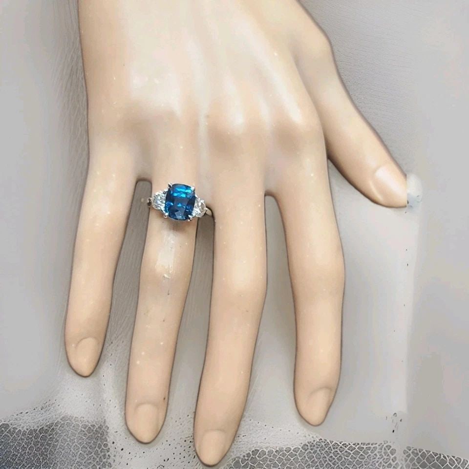 14K WHITE GOLD ENGAGEMENT RING 4.04CT.NATURAL NO HEAT BLUE SAPPHIRE CUSHION GIA: 14K WHITE GOLD ENGAGEMENT RING 4.04CT.NATURAL NO HEAT BLUE SAPPHIRE CUSHION GIA This elegant engagement ring is crafted in solid 14K white gold and showcases a stunning natural teal blue sapphire in a