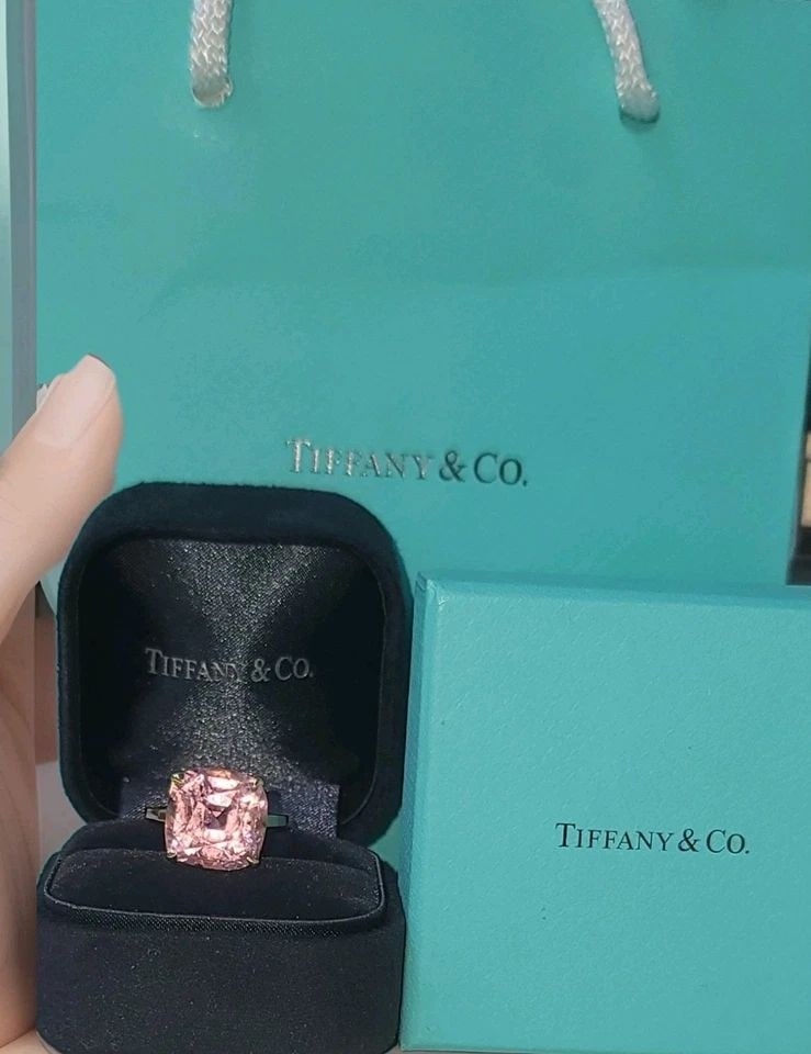 TIFFANY & CO. 18K YELLOW GOLD RING 11.15CT. NATURAL PINK TOURMALINE CUSHION CUT: TIFFANY & CO. 18K YELLOW GOLD RING 11.15CT. NATURAL PINK TOURMALINE CUSHION CUT This authentic Tiffany & Co. ring showcases a breathtaking 9.95 carat natural pink tourmaline, beautifully set in solid 