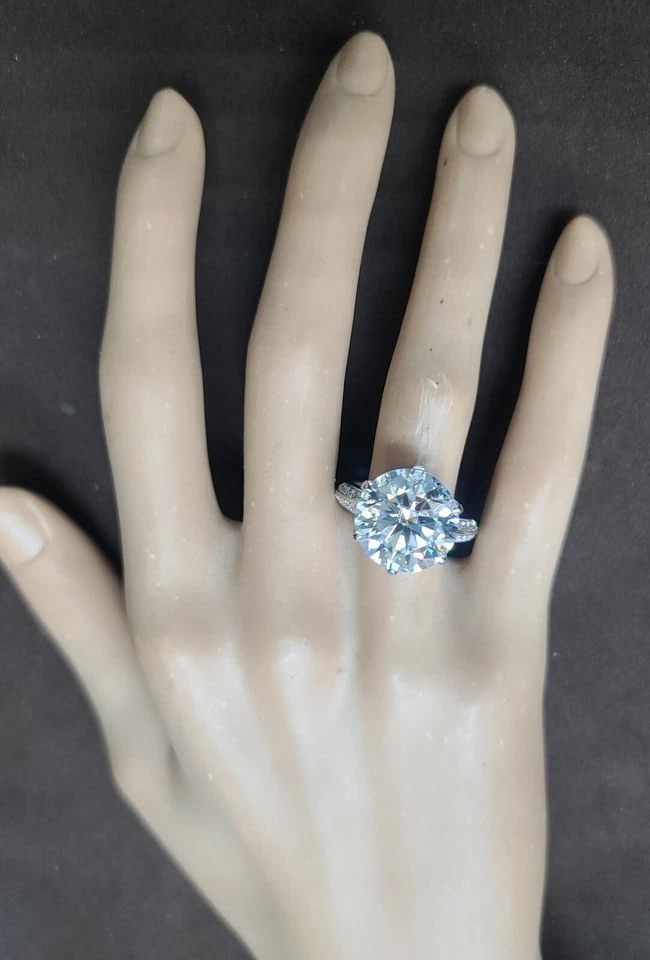 9.18CT PLATINUM VINTAGE ENGAGEMENT RING LAB GROWN SIMULATE ROUND DIAMOND: 9.18CT PLATINUM VINTAGE ENGAGEMENT RING LAB GROWN SIMULATE DIAMOND This stunning vintage engagement ring is the perfect choice for any special occasion. Crafted from high-quality platinum, this ring f