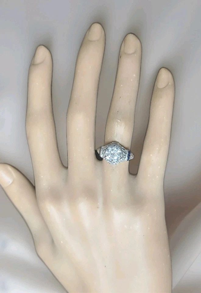 PLATINUM VINTAGE FILIGREE 1.50CT. NATURAL OLD EURO DIAMOND SAPPHIRE RING 1920'S: PLATINUM VINTAGE FILIGREE 1.50CT. NATURAL OLD EURO DIAMOND SAPPHIRE RING 1920'S A breathtaking original Art Deco platinum filigree ring from the 1920s, capturing the elegance of a timeless era. At its