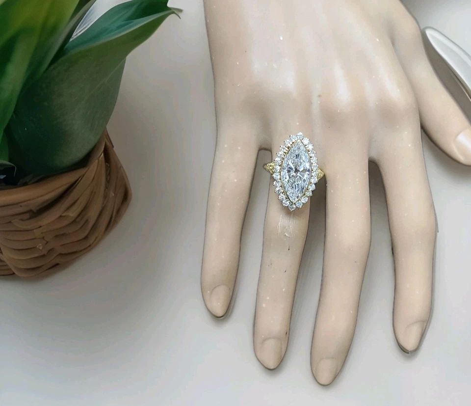 VINTAGE 18K YELLOW GOLD ENGAGEMENT RING 5.06CT.LAB-GROWN MARQUISE EURO DIAMOND: VINTAGE 18K YELLOW GOLD ENGAGEMENT RING 5.06CT.LAB-GROWN MARQUISE EURO DIAMOND This Vintage 18k Yellow Gold Engagement Ring features a stunning 5.06ct Lab-Grown Marquise Euro Diamond as the main stone