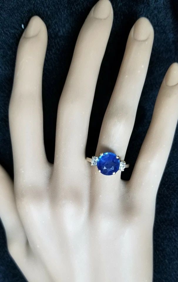 VINTAGE 14K GOLD ENGAGEMENT RING 3.65CT. NATURAL BLUE SAPPHIRE ROUND SHAPE: VINTAGE 14K GOLD ENGAGEMENT RING 3.65CT. NATURAL BLUE SAPPHIRE ROUND SHAPE VINTAGE 14k white & gold DIAMOND AND SAPPHIRE engagement RING CENTER NATURAL BLUE SAPPHIRE IN ROUND CUT WEIGHT 3.65CT SIZE 9.