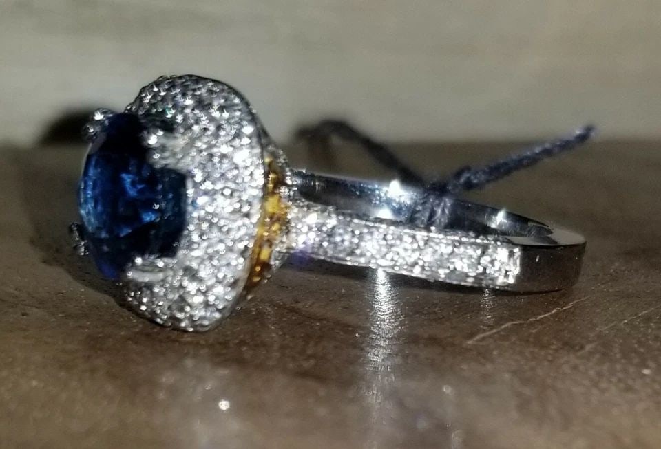 18K WHITE GOLD ENGAGEMENT RING 3.27CT. NATURAL BLUE SAPPHIRE ROUND SHAPE: 18K WHITE GOLD ENGAGEMENT RING 3.27CT. NATURAL BLUE SAPPHIRE ROUND SHAPE GORGEOUS 18K WHITE & YELLOW GOLD natural blue Sapphire round shape center weight 2.01ct. size 8.1mm very nice rich royal blue c