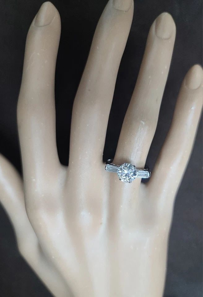 VINTAGE PLATINUM ENGAGEMENT RING 1.04CT.NATURAL ROUND CUT DIAMOND GIA CERT SI1: VINTAGE PLATINUM ENGAGEMENT RING 1.28CT.NATURAL ROUND CUT DIAMOND CIRC 1930'S This vintage platinum engagement ring features a stunning natural round cut diamond with a total weight of 1.28 carats. Th