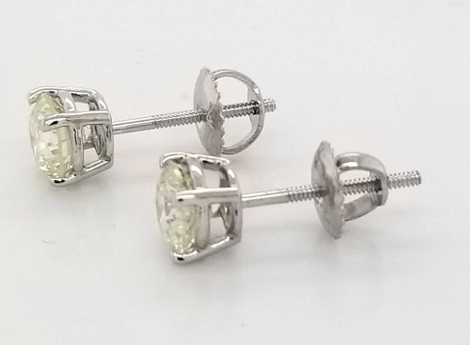 VINTAGE 14K WHITE GOLD STUD EARRINGS FEATURE 2.51 CARATS TOTAL WEIGHT: 2.51CT 14K WHITE GOLD DIAMONDS STUDS EARRINGS SI2-J 14K white gold STUDS EARNINGS . NATURAL clarity enhanced DIAMONDS 2.51 carat total weight SIZE 5.7MM ROUND J-SI2 QUALITY IS VERY NICE CUT VERY LIVEL