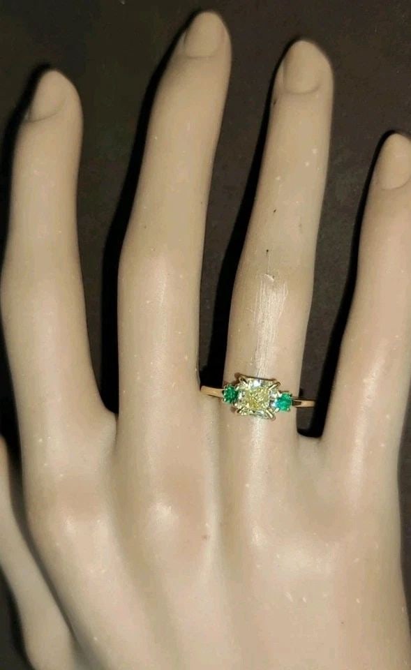 14K YELLOW GOLD VINTAGE ENGAGEMENT RING 1.17CT.NATURAL YELLOW DIAMOND RADIANT: 14K YELLOW GOLD VINTAGE ENGAGEMENT RING 1.17CT.NATURAL YELLOW DIAMOND RADIANT This 14k Yellow Gold Ring features a 1.17CT Natural Yellow Diamond in a radiant shape, accented with two additional natura