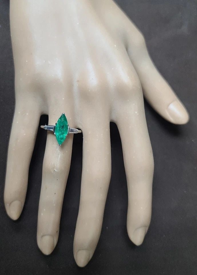 VINTAGE PLATINUM ENGAGEMENT RING 2.09CT. GEM NATURAL GREEN EMERALD MARQUISE CUT: VINTAGE PLATINUM ENGAGEMENT RING 2.09CT. GEM NATURAL GREEN EMERALD MARQUISE CUT This exquisite vintage engagement ring boasts a stunning 2.09CT natural green emerald marquise cut in a prong setting. T