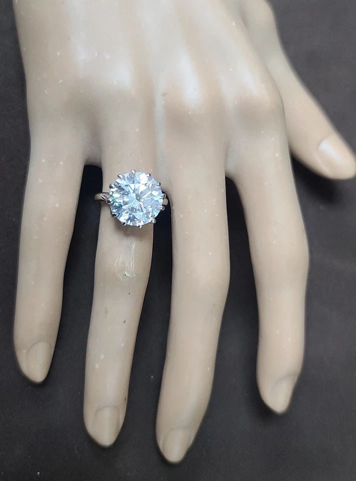 10K WHITE GOLD VINTAGE ENGAGEMENT RING 6.02CT. LAB GROWN SIMULATE DIAMOND: 6.02CT 14K WHITE GOLD VINTAGE ENGAGEMENT RING LAB GROWN SIMULATE DIAMOND This stunning vintage engagement ring is the perfect symbol of love and commitment. Crafted from 14k white gold , it boasts a s