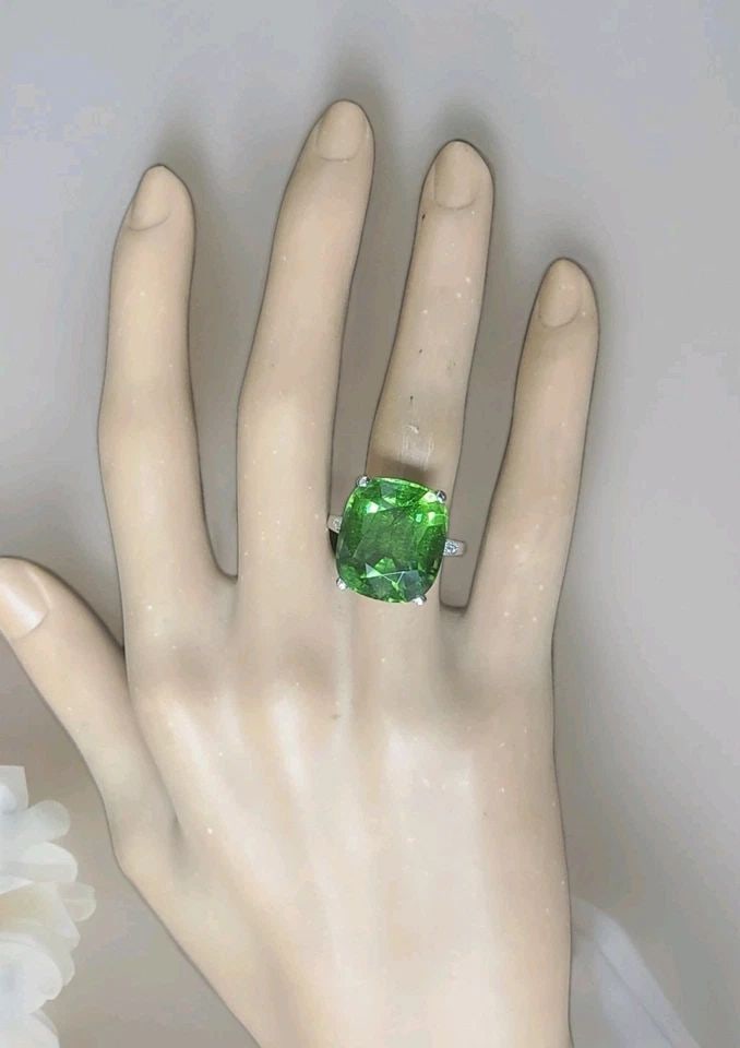 VINTAGE 14K WHITE GOLD ENGAGEMENT RING 21.01CT.NATURAL GREEN TOURMALINE CUSHION: VINTAGE 14K WHITE GOLD ENGAGEMENT RING 21.01CT.NATURAL GREEN TOURMALINE CUSHION This Vintage 14k White Gold Engagement Ring features a stunning 21.01CT Natural Green Tourmaline in a cushion shape, sur