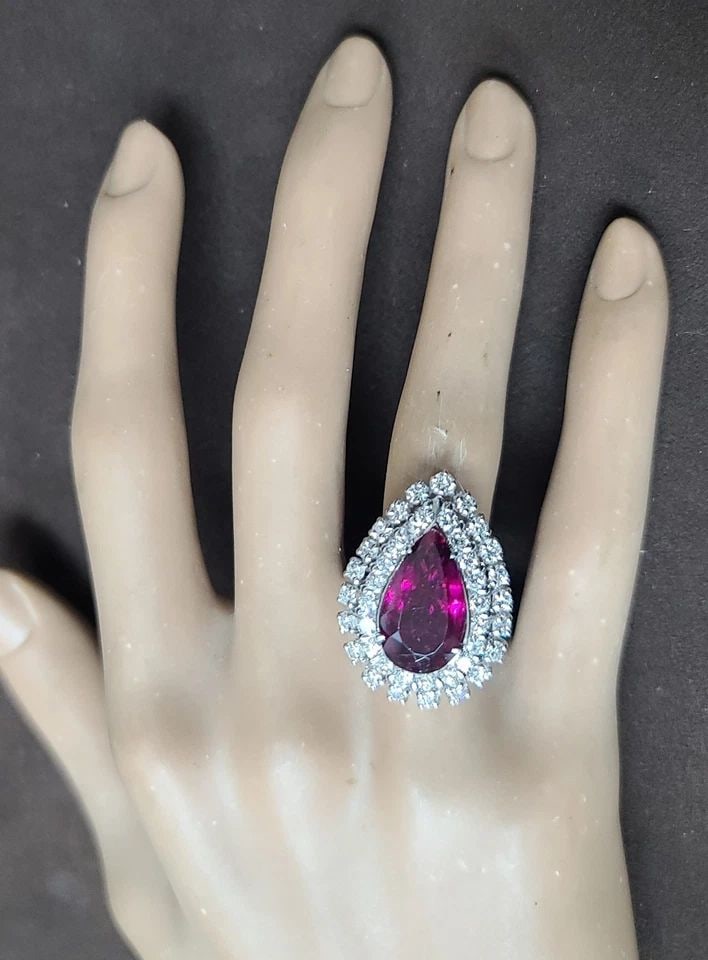 VINTAGE 14K WHITE GOLD ENGAGEMENT RING 5.63CT. NATURAL RUBELLITE TOURMALINE PEAR: VINTAGE 14K WHITE GOLD ENGAGEMENT RING 5.63CT. NATURAL RUBELLITE TOURMALINE PEAR This Vintage 14k White Gold Engagement Ring features a stunning 5.63ct Natural Rubellite Tourmaline in a Pear shape as 