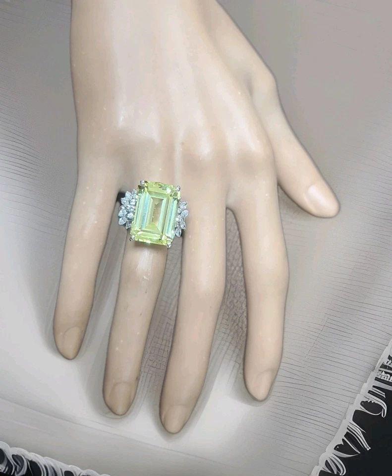 20.34 CT RECTANGULAR YELLOW SAPPHIRE VINTAGE PLATINUM RING WITH DIAMOND ACCENTS: 20.34 ct Rectangular Yellow Sapphire Vintage Platinum Ring with Diamond Accents This exquisite vintage platinum ring from the 1930s showcases a magnificent lab-grown yellow sapphire in an elegant emer