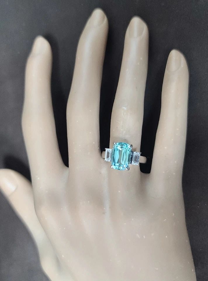 14K WHITE GOLD ENGAGEMENT RING 4.21CT.NATURAL SKY BLUE TOURMALINE CUSHION SHAPE: 14K WHITE GOLD ENGAGEMENT RING 4.23CT.NATURAL SKY BLUE TOURMALINE CUSHION SHAPE 14k white gold engagement ring NATURAL SKY BLUE TOURMALINE CENTER SET IN CUSHION CUT WEIGHT 4.23CARAT SIZE 10.7x7.4MM GO