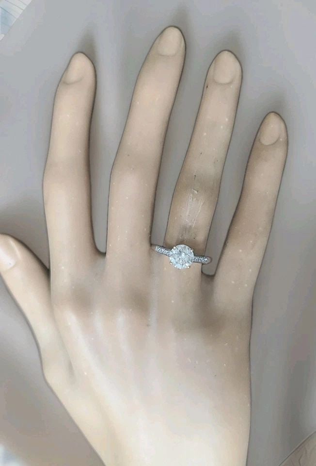 PLATINUM VINTAGE FILIGREE ENGAGEMENT RING 1.45CT. NATURAL ROUND DIAMOND 1920'S: PLATINUM VINTAGE FILIGREE ENGAGEMENT RING 1.45CT. NATURAL ROUND DIAMOND 1920'S A stunning original Art Deco ring from the 1920s, crafted in platinum with a 14K yellow gold head. The centerpiece is a 1