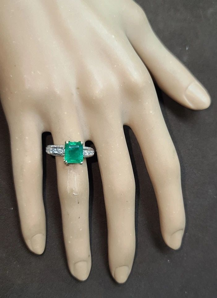 VINTAGE 14K TWO-TONE GOLD ENGAGEMENT RING 2.09CT NATURAL GREEN EMERALD DIAMOND: VINTAGE 14K TWO-TONE GOLD ENGAGEMENT RING 2.09CT NATURAL GREEN EMERALD DIAMOND This Vintage 14k Two-tone gold Engagement ring features a stunning 2.09ct Natural Green Emerald as the main stone. The ri