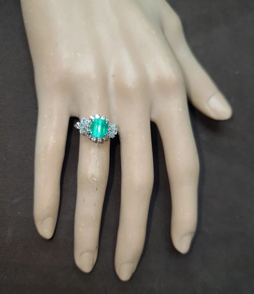 PLATINUM VINTAGE FILIGREE 1.67CT. NATURAL COLOMBIA EMERALD RING CIRC 1930'S: This exquisite vintage ring from the 1930s is a true treasure. The stunning 1.67 carat natural Colombian emerald stone is beautifully complemented by the sparkling diamonds and intricate filigree desi