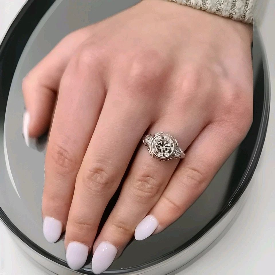 14K WHITE GOLD FILIGREE ENGAGEMENT RING 1.65CT. LAB GROWN OLD EURO CUT DIAMOND: 14K WHITE GOLD FILIGREE ENGAGEMENT RING 1.65CT. LAB GROWN OLD EURO CUT DIAMOND This 14k white gold Filigree Engagement Ring features a 1.65ct lab grown Old Euro Cut Diamond as the main stone. The vint