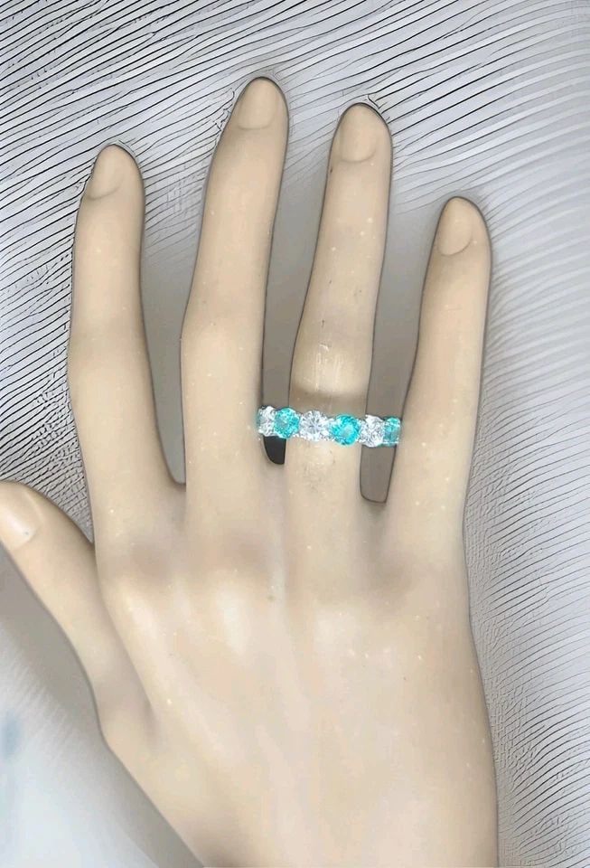 14K WHITE GOLD ETERNITY RING 11.09CT. DIAMOND BLUE NEON PARAIBA TOURMALINE ROUND: 14K WHITE GOLD ETERNITY RING 11.09CT. DIAMOND BLUE NEON PARAIBA TOURMALINE ROUND This gorgeous eternity ring is beautifully crafted in solid 14K white gold, making it a perfect choice as a wedding ban