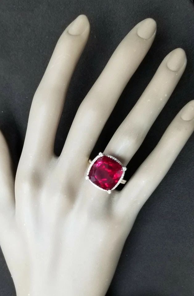 STUNNING 14K YELLOW GOLD ENGAGEMENT RING 14.87CT. LAB GROWN VIVID RUBY CUSHION: STUNNING 14K YELLOW GOLD ENGAGEMENT RING 14.87CT. GEM VIVID RUBY CUSHION SHAPE Gorgeous 14k yellow gold ruby ring, Center set lab-grown ruby in cushion cut ruby weight 14.87ct. Size 14x14 This ruby is