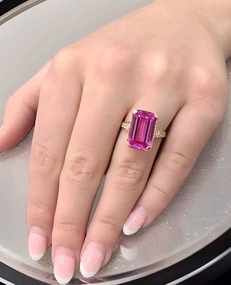 VINTAGE 14K YELLOW GOLD ENGAGEMENT RING 6.67CT.LAB GROWN PINK SAPPHIRE: VINTAGE 14K WHITE GOLD ENGAGEMENT RING 6.67CT. PINK SAPPHIRE RECTANGULAR CUT This vintage engagement ring boasts a beautiful pink sapphire stone, set in a square shape on a prong setting. The stone is