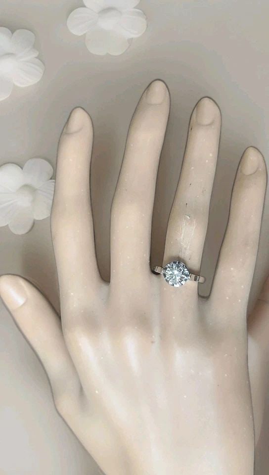 PLATINUM VINTAGE ENGAGEMENT RING 1.02CT. NATURAL ROUND CHAMPAGNE DIAMOND: PLATINUM VINTAGE ENGAGEMENT RING 1.02CT. NATURAL ROUND CHAMPAGNE DIAMOND This Platinum Vintage Engagement ring features a 1.02ct natural round Champagne Diamond as the main stone, making it a unique a