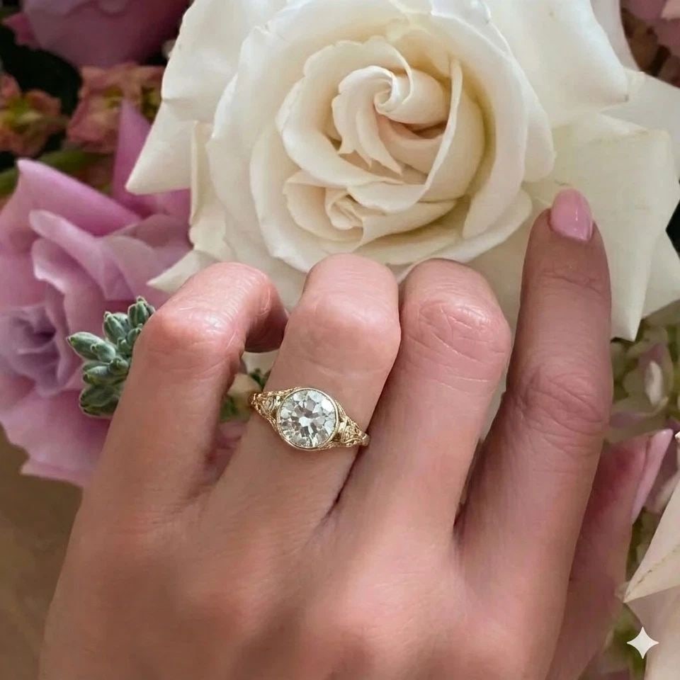 14K YELLOW GOLD VINTAGE FILIGREE ENGAGEMENT RING 2.02CT.LAB-GROWN ROUND DIAMOND: 14K YELLOW GOLD VINTAGE FILIGREE ENGAGEMENT RING 2.02CT.LAB-GROWN ROUND DIAMOND This stunning vintage Art Deco filigree engagement ring, crafted in 14K yellow gold, features a lab grown round-cut diam