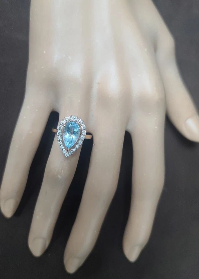 14K ROSE GOLD ENGAGEMENT RING 2.18 CT NATURAL SKY BLUE AQUAMARINE PEAR SHAPE: 14K ROSE GOLD ENGAGEMENT RING 2.18.CT. NATURAL SKY BLUE AQUAMARINE PEAR SHAPE STUNNING 14K ROSE GOLD ENGAGEMENT RING. NATURAL GEM SKY BLUE AQUAMARINE IN PEAR SHAPE CENTER 2.18CARAT NATURAL AQUAMARINE 