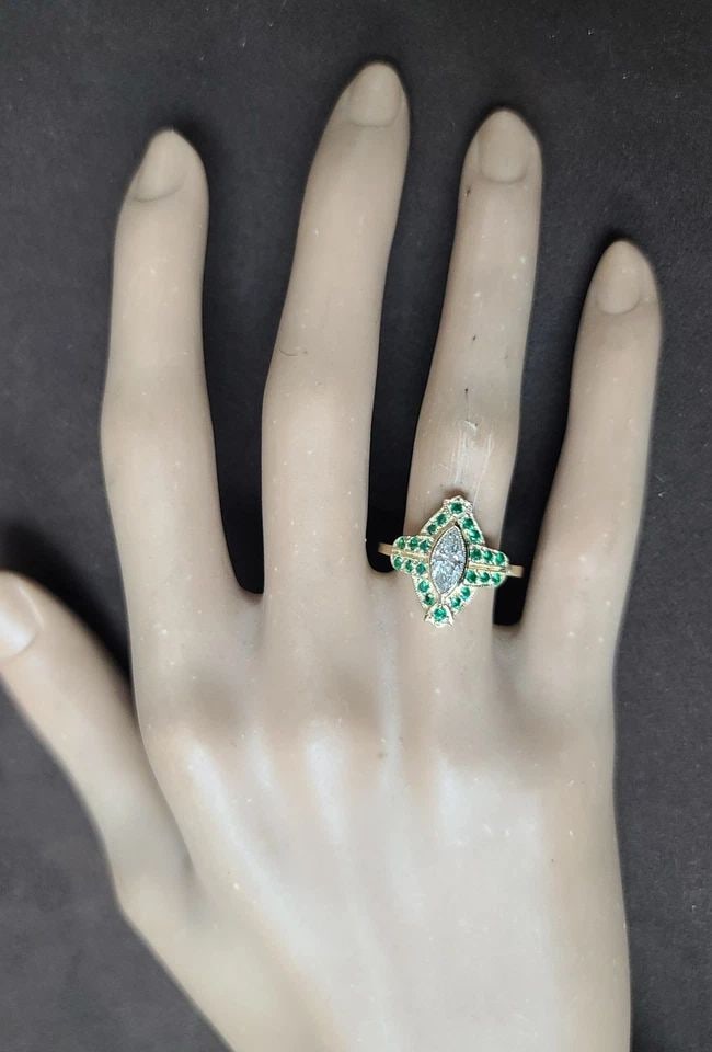 14K YELLOW GOLD VINTAGE ENGAGEMENT RING 0.58CT.NATURAL MARQUISE DIAMOND EMERALD: 14K YELLOW GOLD VINTAGE ENGAGEMENT RING 0.58CT.NATURAL MARQUISE DIAMOND EMERALD This 14k yellow gold vintage engagement ring features a stunning 0.58ct natural marquise diamond as the main stone, with