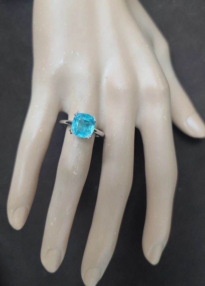 VINTAGE 14K WHITE GOLD ENGAGEMENT RING 5.50CT.BLUE NEON TOURMALINE CUSHION: VINTAGE 14K WHITE GOLD ENGAGEMENT RING 5.50CT.BLUE NEON TOURMALINE CUSHION This gorgeous vintage 14K white gold engagement ring features a stunning natural blue tourmaline in an elegant cushion shape,