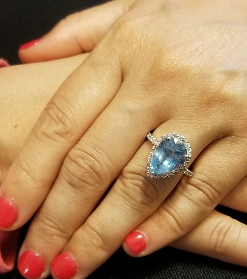 5.03CT NATURAL PEAR AQUAMARINE RING 14K WHITE GOLD WITH 0.75CT DIAMOND ACCENTS: 14K WHITE GOLD RING 5.03CT.NATURAL AQUAMARINE IN PEAR SHAPE Gorgeous elegant 14k white gold ring natural aquamarine pear shape Center natural aquamarine in pear shape weight 5.03ct. size 14x10mm very 